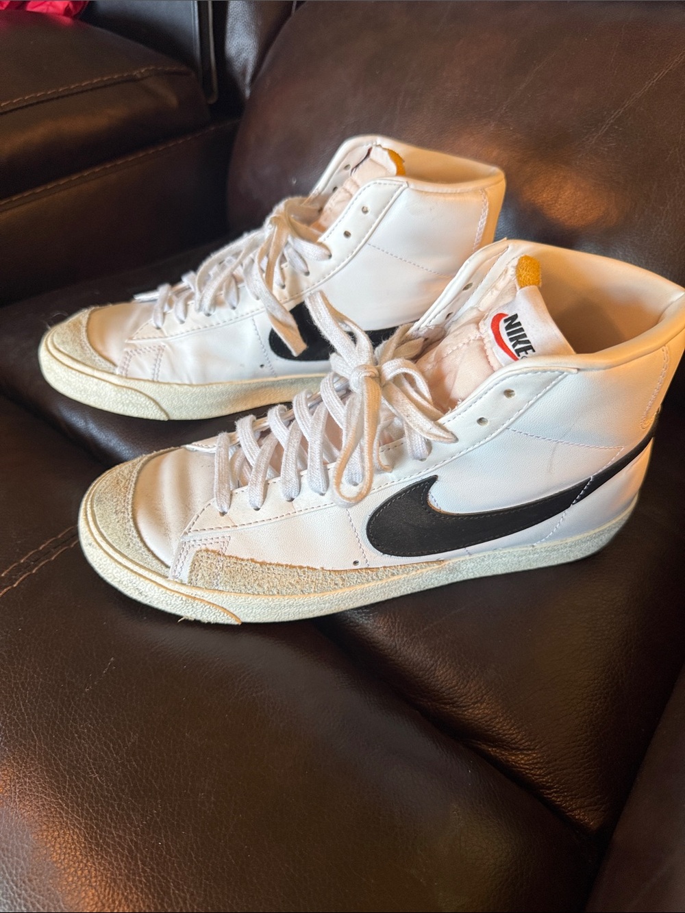 Nike White High-Top Sneakers with Black Swoosh